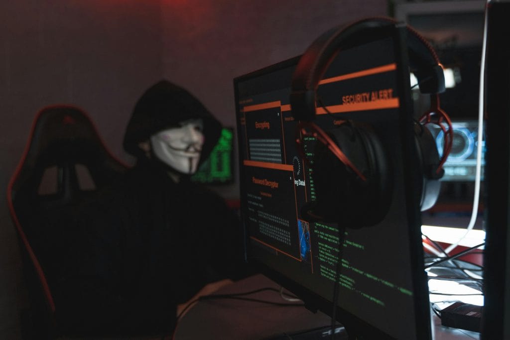 pexels-photo-5380651-5380651 Person in Black Hoodie Hacking a Computer System